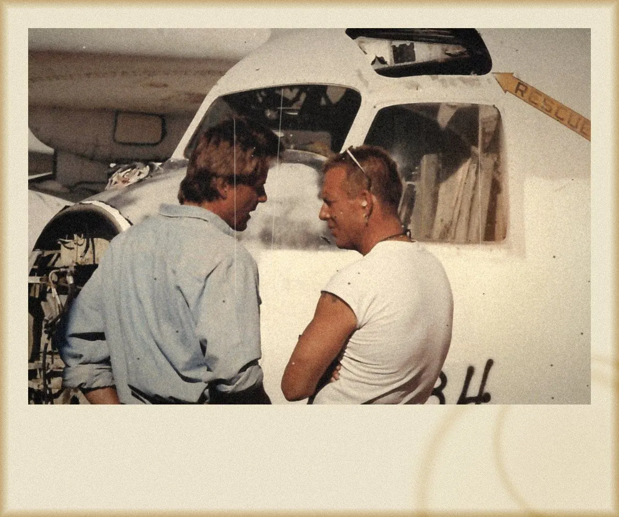 Between setups beside a plane marked Rescue